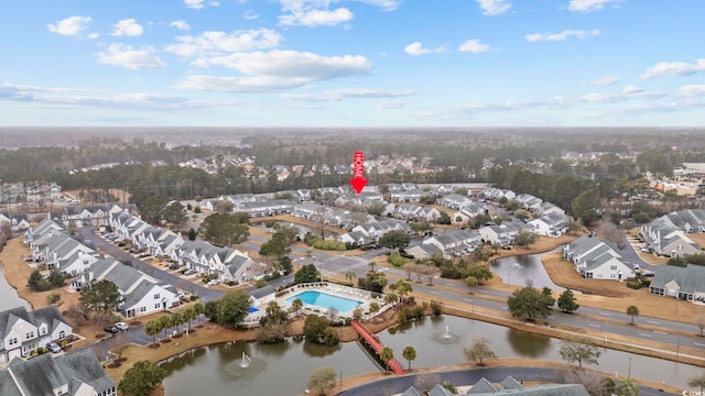 drone / aerial view with a water view and a residential view