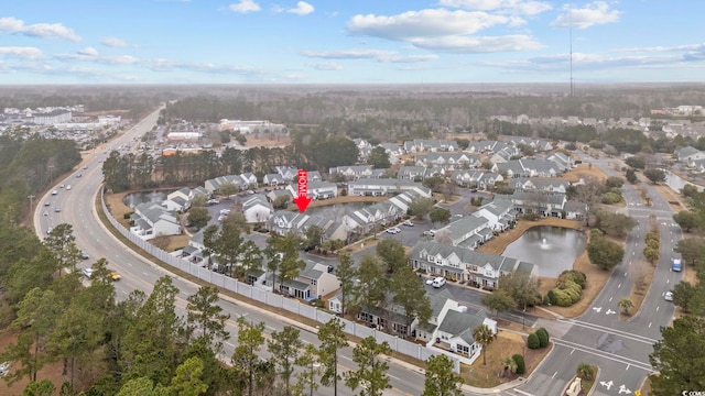 bird's eye view featuring a water view and a residential view