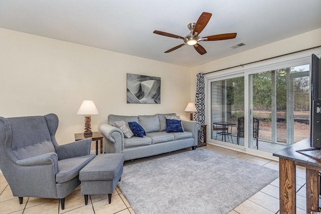 living room with light tile patterned floors and ceiling fan