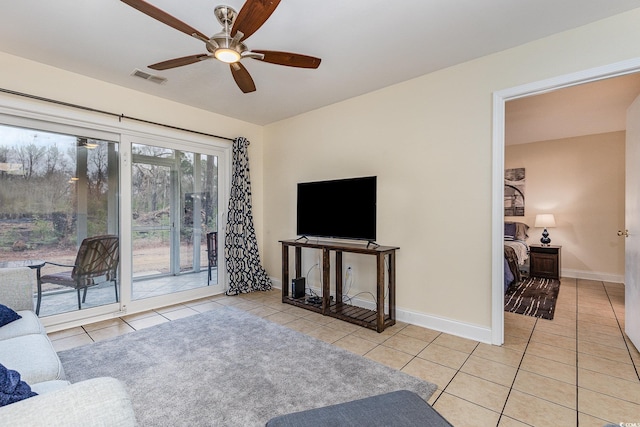 living room with light tile patterned flooring and ceiling fan