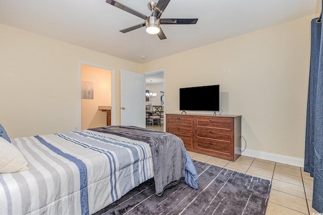 bedroom featuring tile patterned floors and ceiling fan with notable chandelier