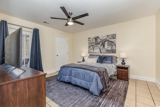 tiled bedroom with ceiling fan