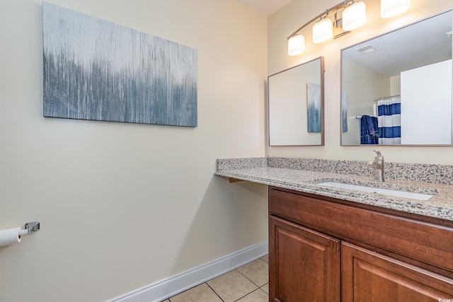 bathroom with tile patterned flooring and vanity