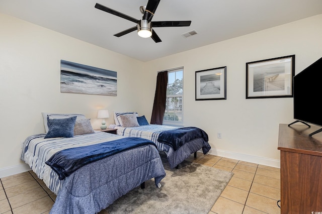 bedroom with light tile patterned floors and ceiling fan