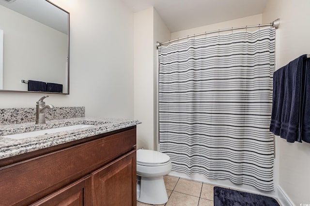 bathroom featuring vanity, curtained shower, tile patterned floors, and toilet