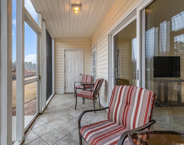 sunroom with wooden ceiling