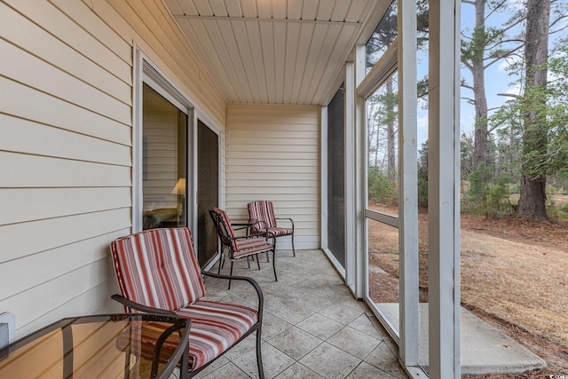 sunroom featuring wooden ceiling