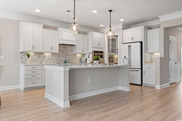 kitchen featuring a kitchen island with sink, white cabinetry, and custom exhaust hood