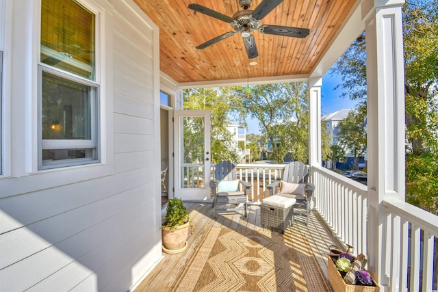 wooden deck with ceiling fan