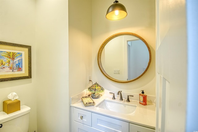 bathroom with vanity and toilet