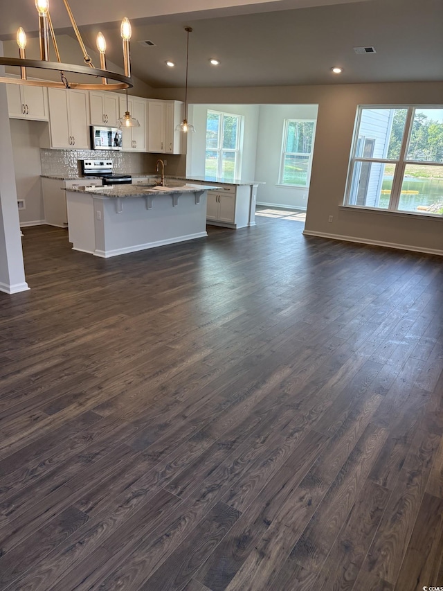 174 Glengrove Ln, Murrells Inlet, SC 29576 - kitchen with appliances with stainless steel finishes, dark wood-style flooring, white cabinetry, and recessed lighting