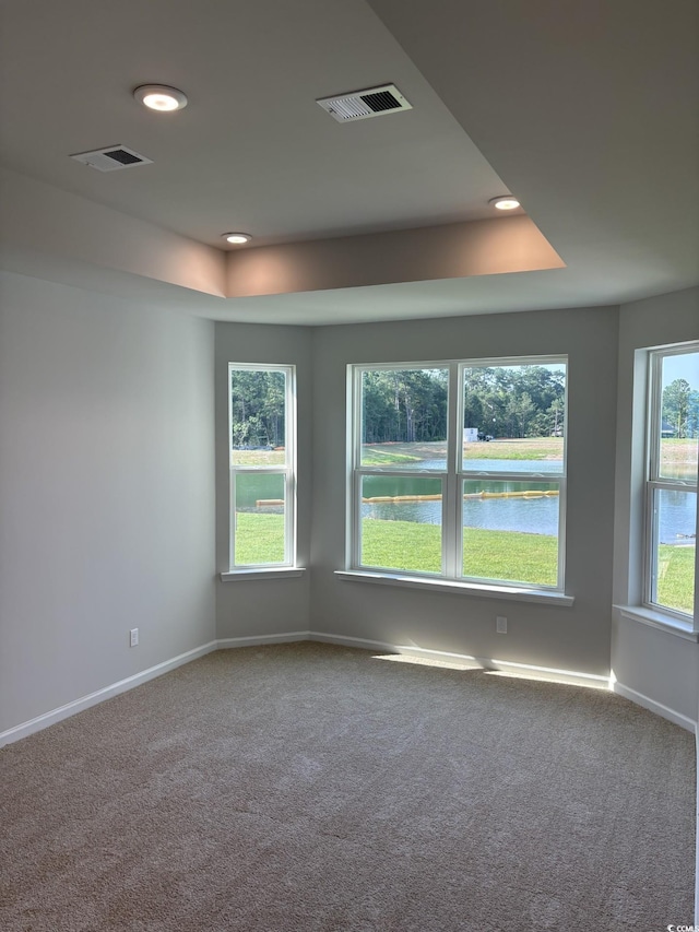 174 Glengrove Ln, Murrells Inlet, SC 29576 - carpeted spare room with a raised ceiling, recessed lighting, and a water view