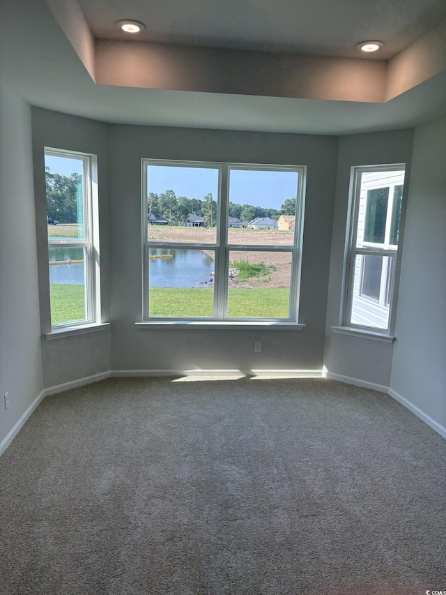 174 Glengrove Ln, Murrells Inlet, SC 29576 - carpeted empty room with a raised ceiling, a water view, and recessed lighting
