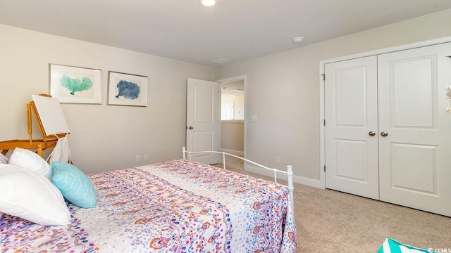 carpeted bedroom with a closet