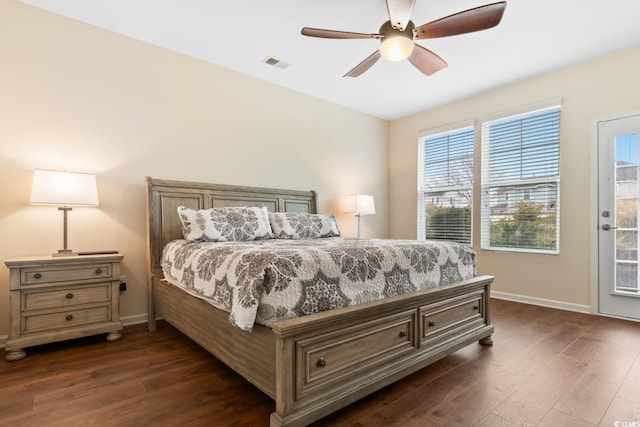 bedroom featuring access to outside, dark wood finished floors, visible vents, and baseboards