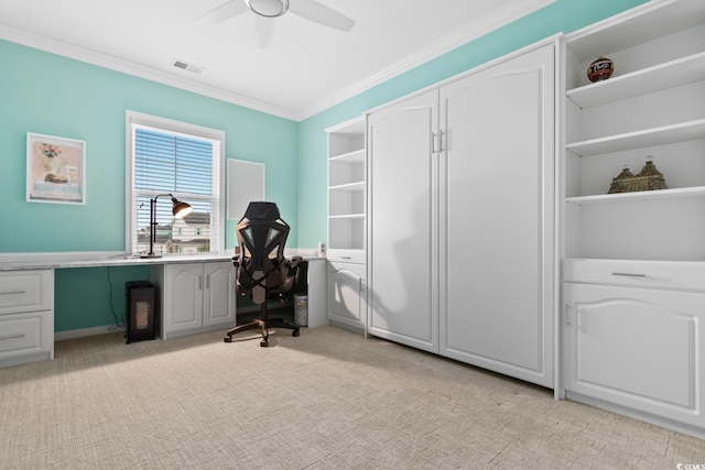 home office featuring light carpet, visible vents, ceiling fan, ornamental molding, and a sink