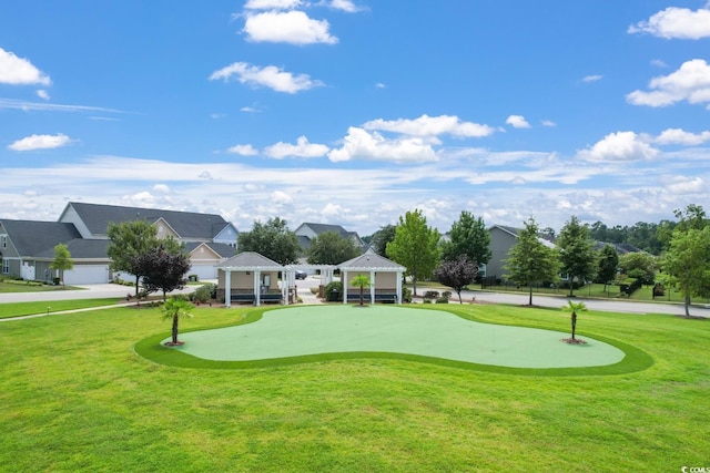 surrounding community featuring a gazebo and a lawn