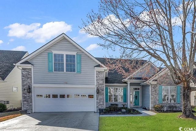 traditional home with an attached garage, brick siding, driveway, and a front lawn