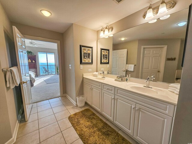 8500 Margate Cir Unit 1604, Myrtle Beach, SC 29572 - ensuite bathroom with tile patterned flooring, double vanity, baseboards, and a sink