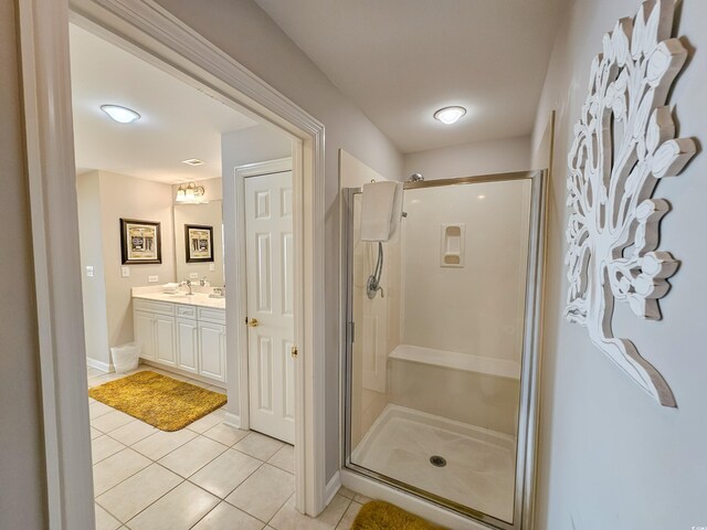 8500 Margate Cir Unit 1604, Myrtle Beach, SC 29572 - full bathroom featuring vanity, tile patterned floors, baseboards, and a shower stall