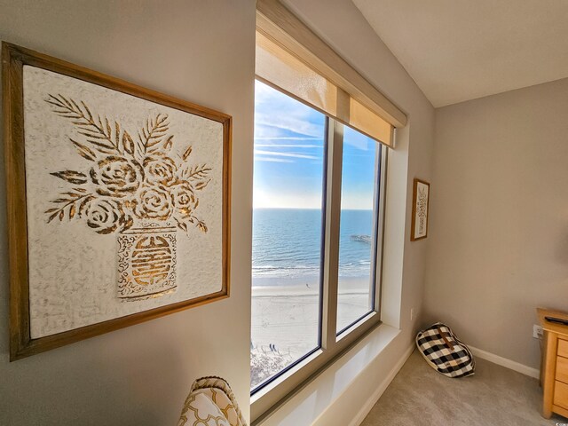 8500 Margate Cir Unit 1604, Myrtle Beach, SC 29572 - interior space featuring baseboards, light carpet, a healthy amount of sunlight, and a water view