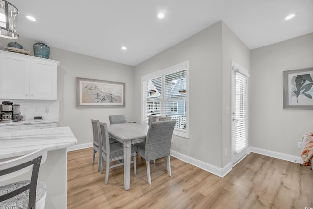 dining area with light wood-type flooring