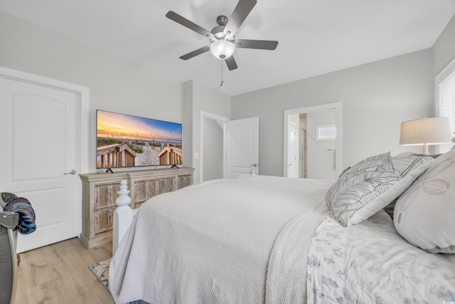 bedroom with ceiling fan and light hardwood / wood-style flooring