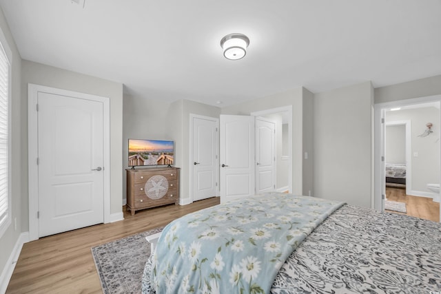 bedroom with light wood-type flooring