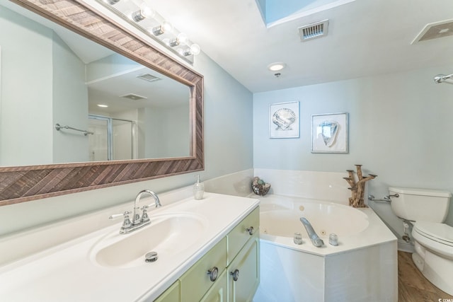 full bath featuring vanity, toilet, visible vents, and a whirlpool tub