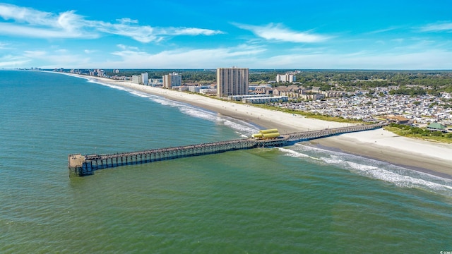 birds eye view of property featuring a beach view and a water view