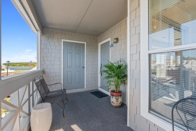 doorway to property featuring a balcony