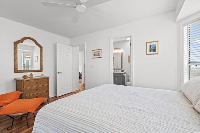 bedroom with hardwood / wood-style flooring, ceiling fan, and ensuite bathroom