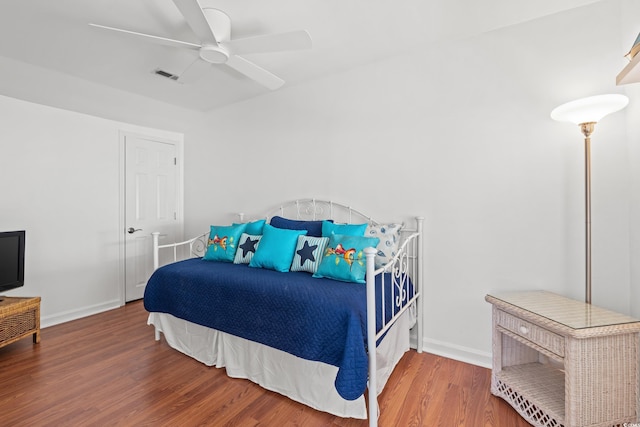 bedroom featuring hardwood / wood-style flooring and ceiling fan