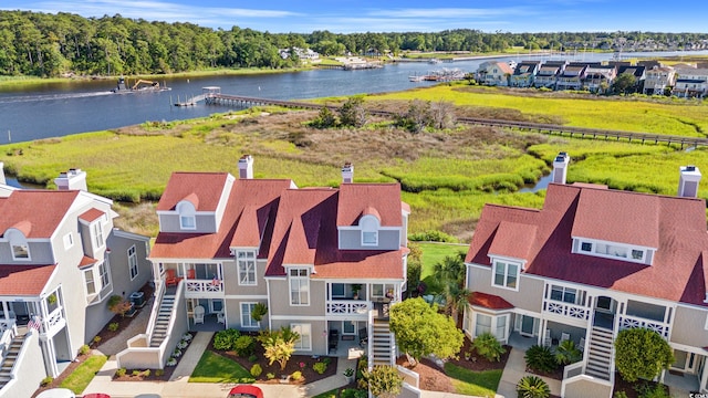 birds eye view of property with a water view