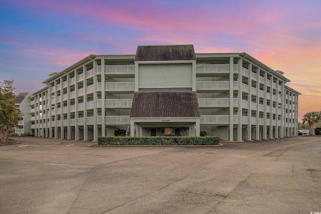 view of outdoor building at dusk