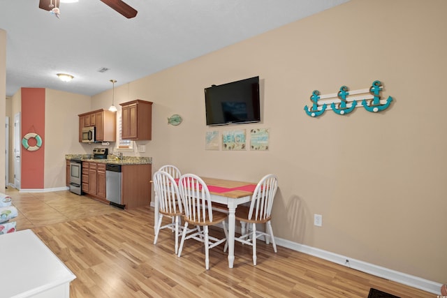 dining area featuring ceiling fan and light hardwood / wood-style floors