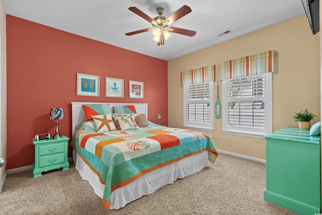 carpeted bedroom with ceiling fan