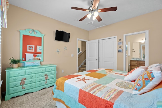 bedroom with carpet floors, a closet, ceiling fan, and ensuite bathroom