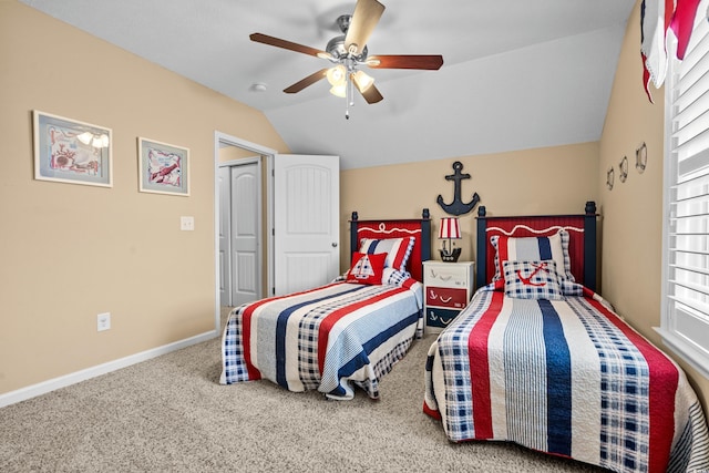 carpeted bedroom featuring ceiling fan and vaulted ceiling