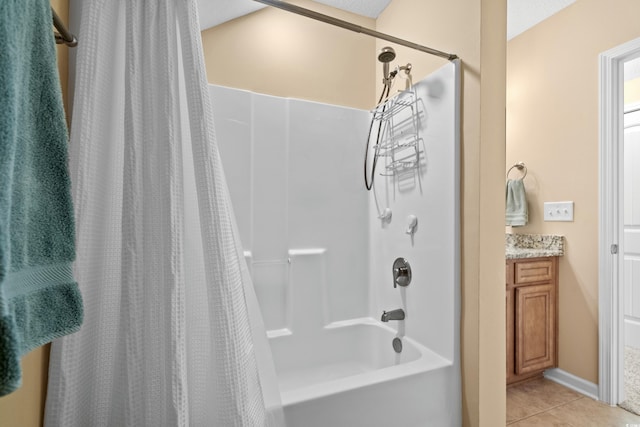 bathroom with tile patterned flooring, shower / tub combo, and vanity