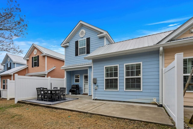 back of house featuring a patio