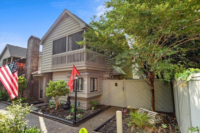 view of home's exterior featuring a balcony