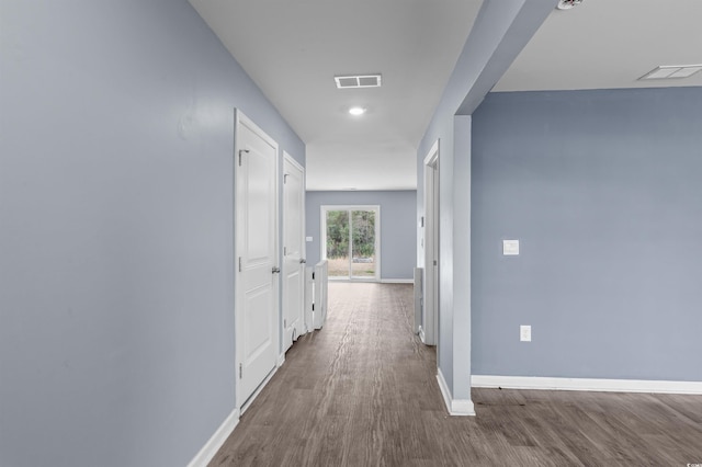 hallway with wood-type flooring