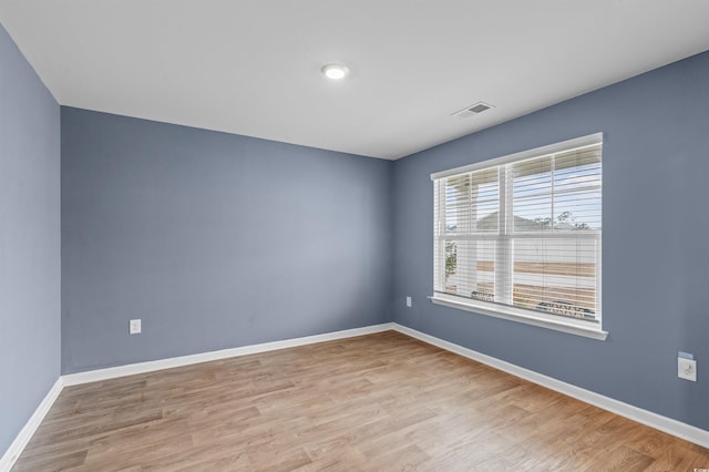 unfurnished room featuring light wood-type flooring