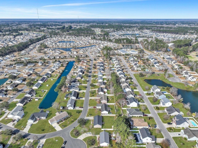 bird's eye view with a residential view and a water view