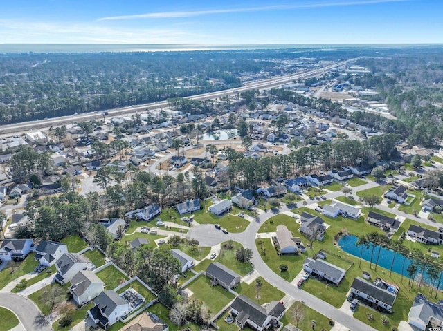 bird's eye view with a residential view and a water view