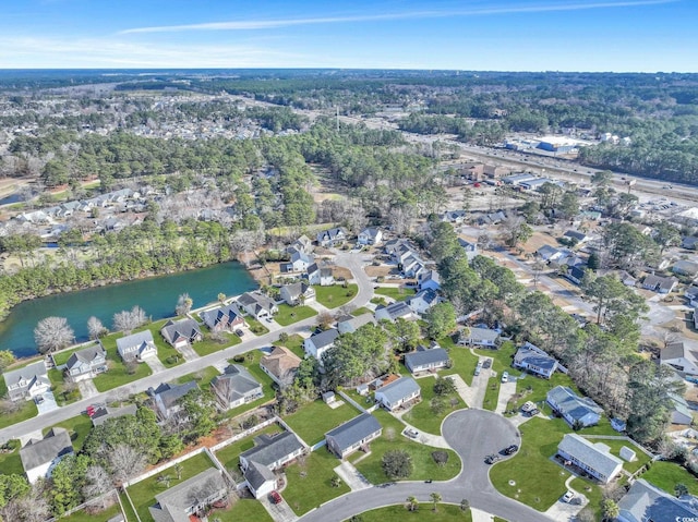 drone / aerial view featuring a water view and a residential view