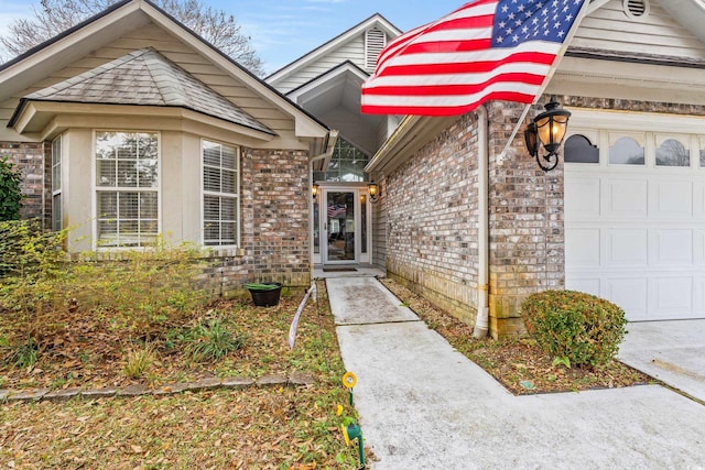 view of exterior entry with a garage