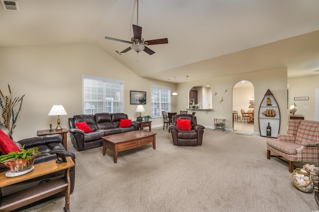 carpeted living room with lofted ceiling and ceiling fan