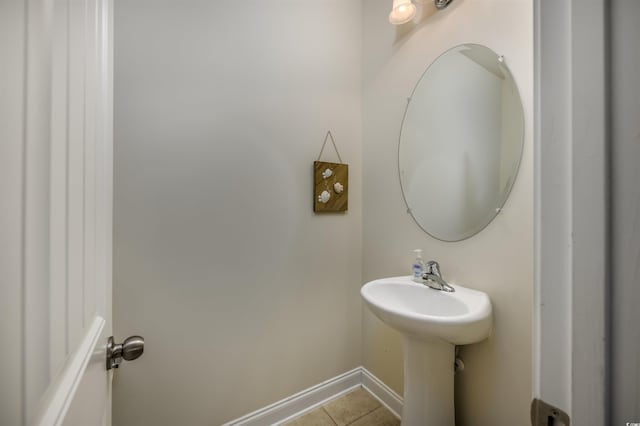 bathroom featuring sink and tile patterned flooring